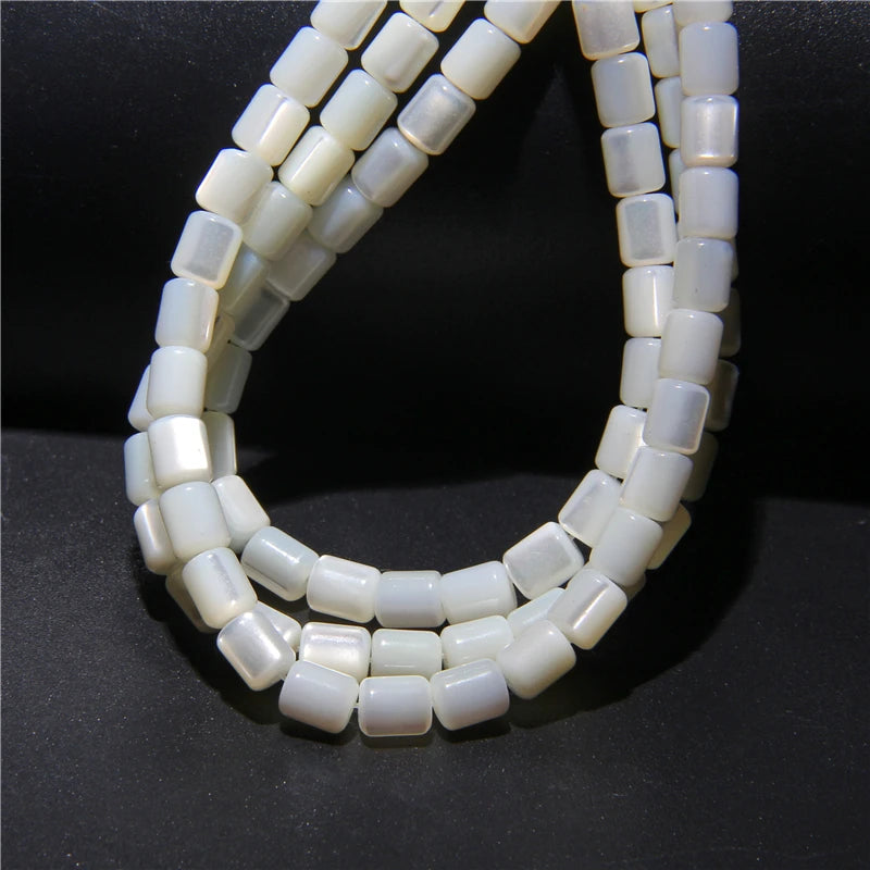 Mostacillas (cuentas) de concha de nácar blanca natural de 5x6mm, con forma de barril, para fabricación de joyería, de aproximadamente 38cm por hebra