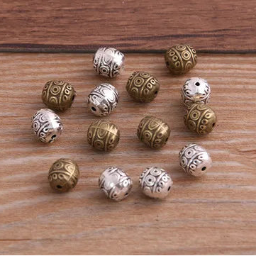 12 Uds. De mostacillas espaciadoras ovaladas de dos colores de 7x7x8mm para joyería artesanal